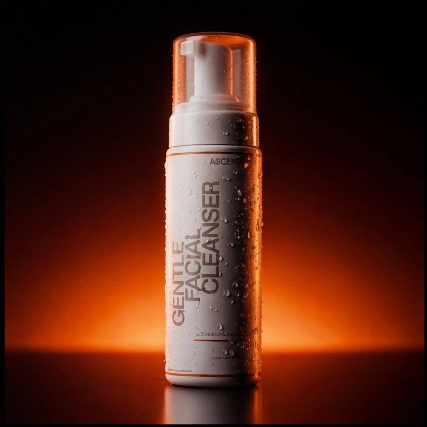 ASCEND Gentle Facial Cleanser bottle with water droplets against a dark, orange-lit background.